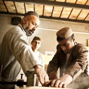 A young man participating in a carpentry class in afghanistan