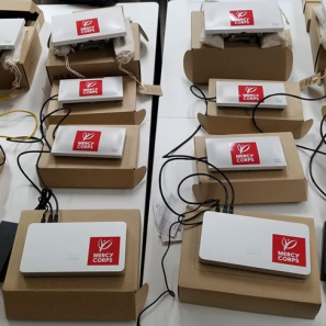 Electronic equipment used for wireless communication is laid out on a table.