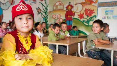 Children seated at desks in school in kyrgyzstan