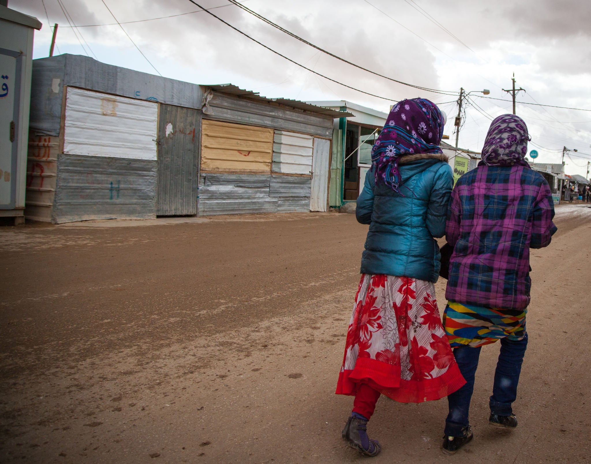 Image: Two girls walking from behind in Za'atari Camp for Syrian refugees
