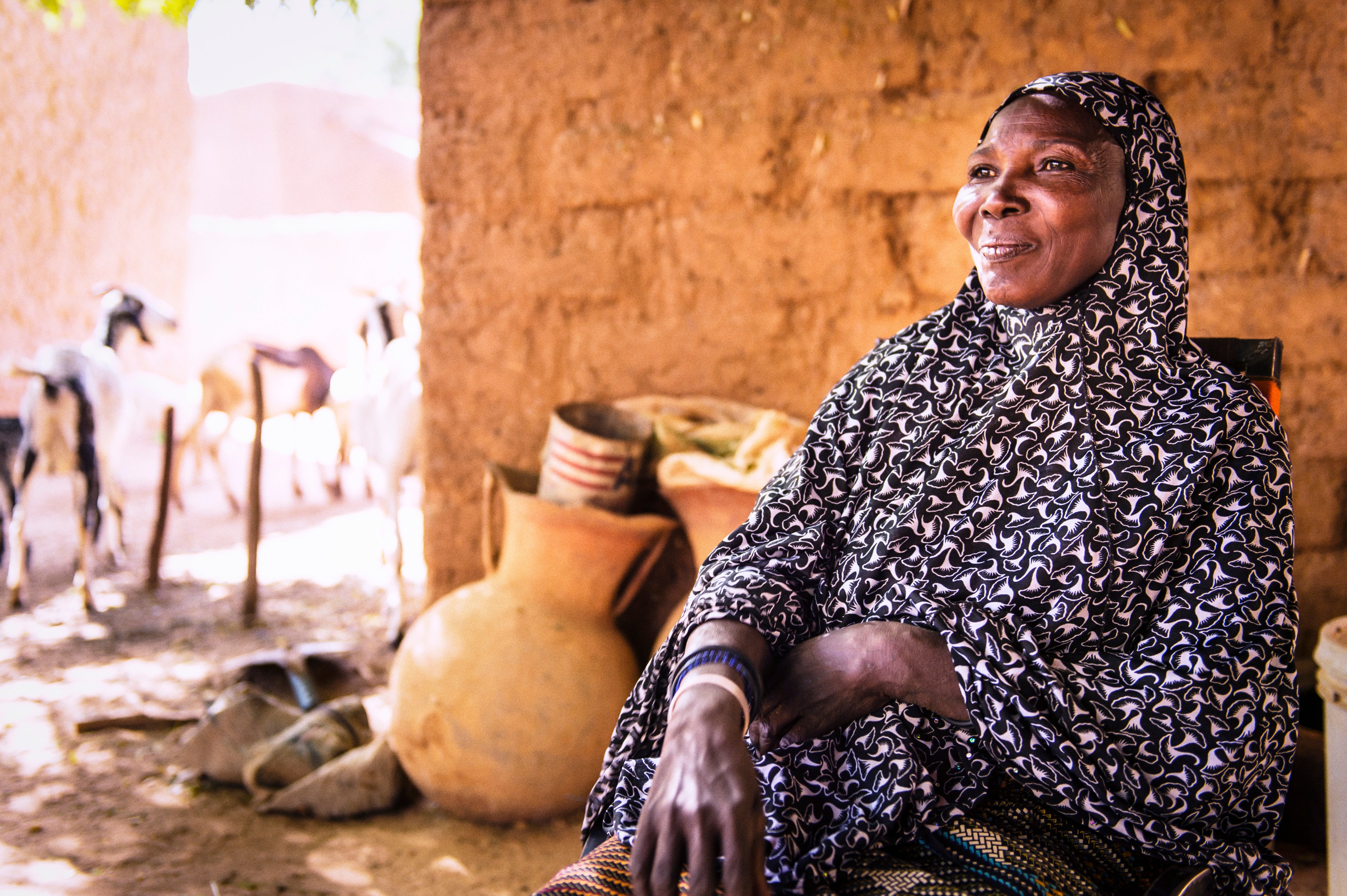 A woman in Niger smiling and looking into the distance