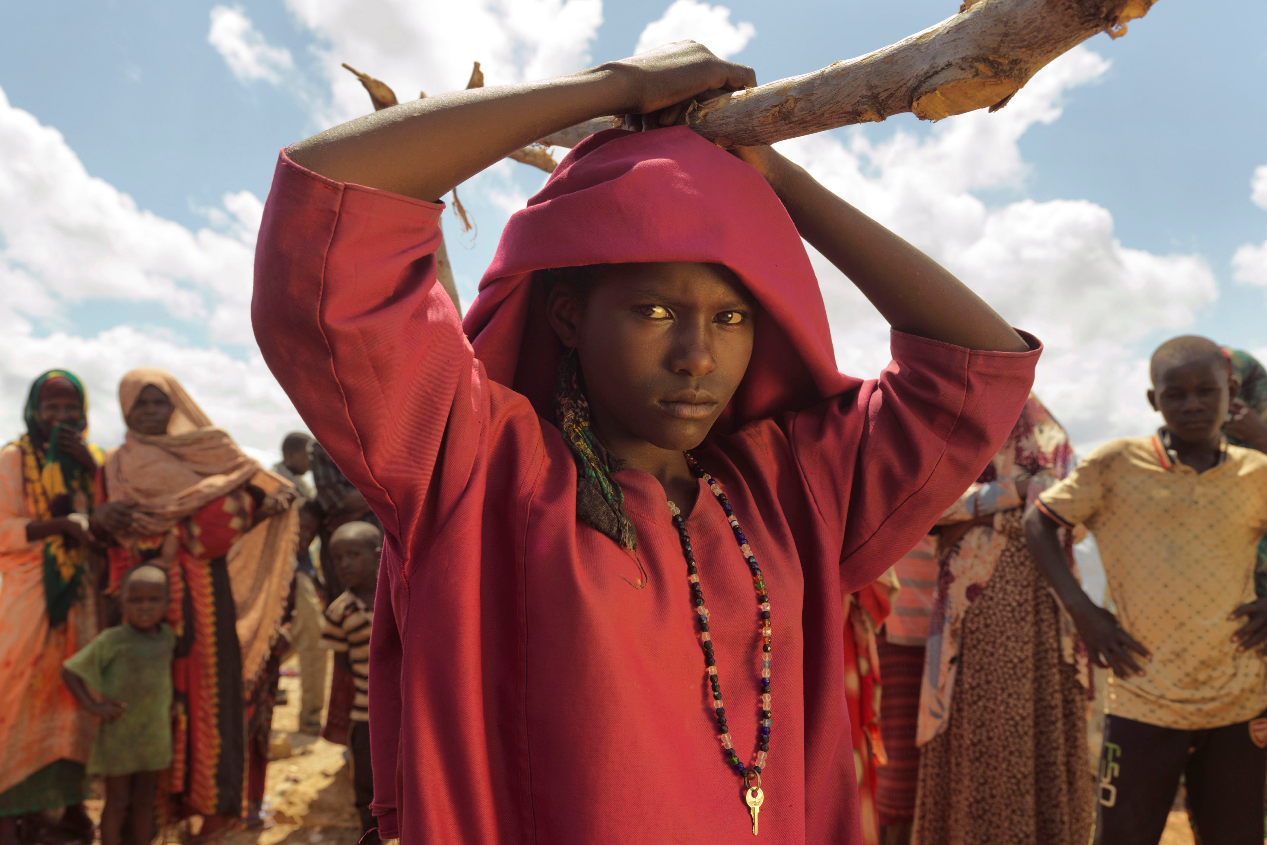 Girl in Somalia with red top and scarf