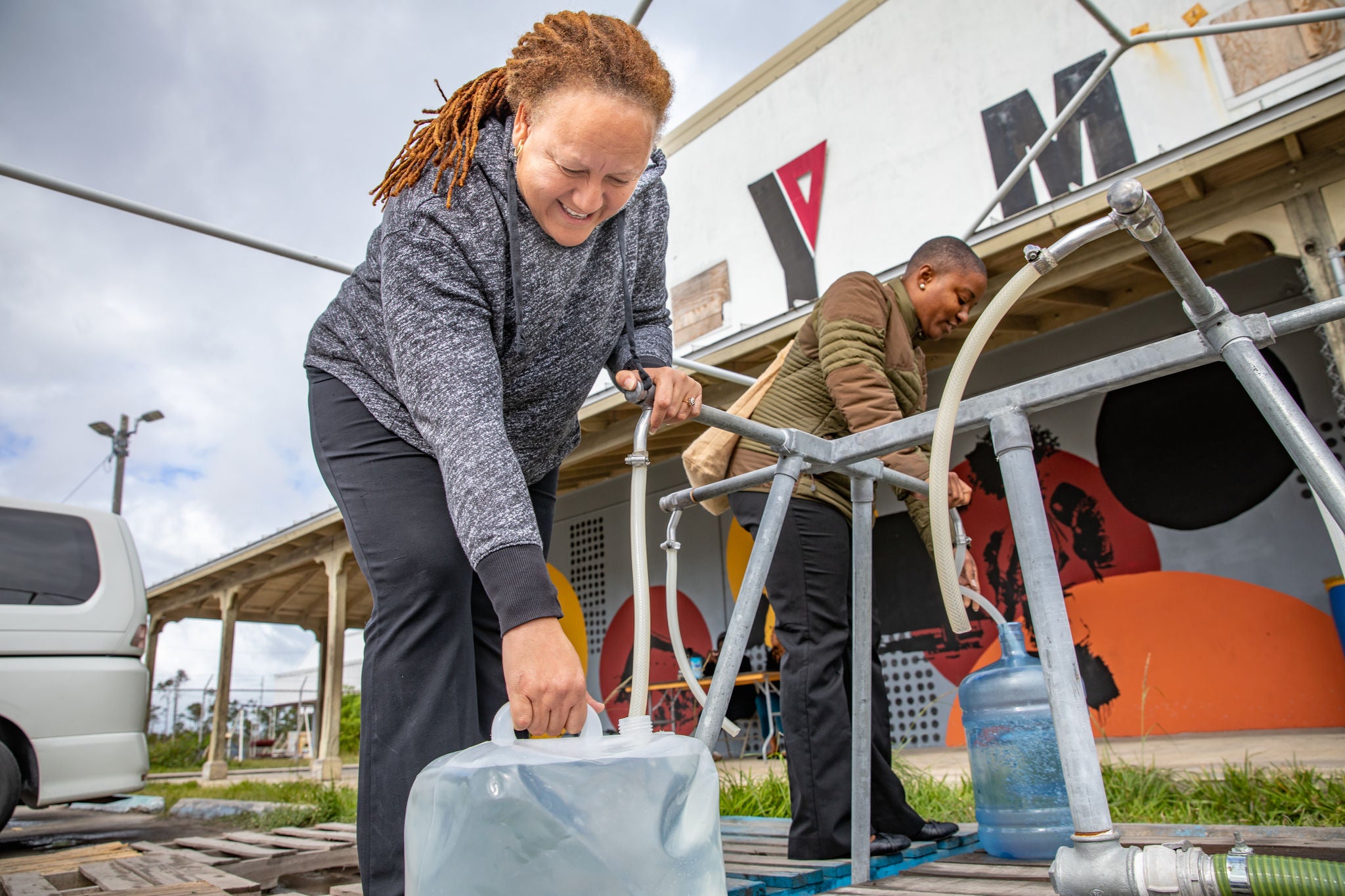 Bahamian filling water jug.
