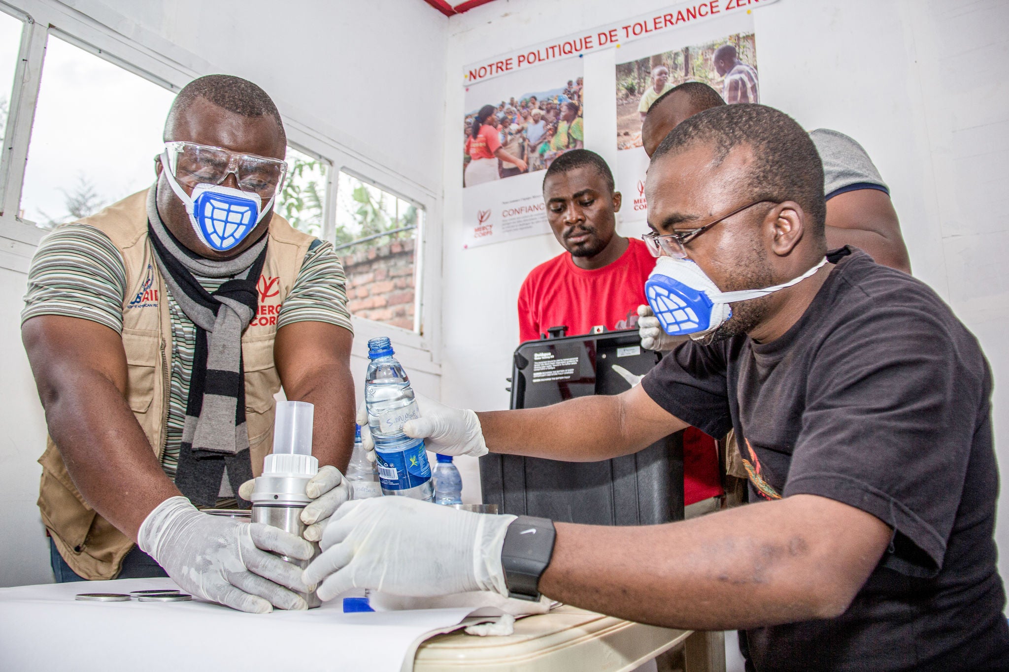Congolese men working in a laboratory.