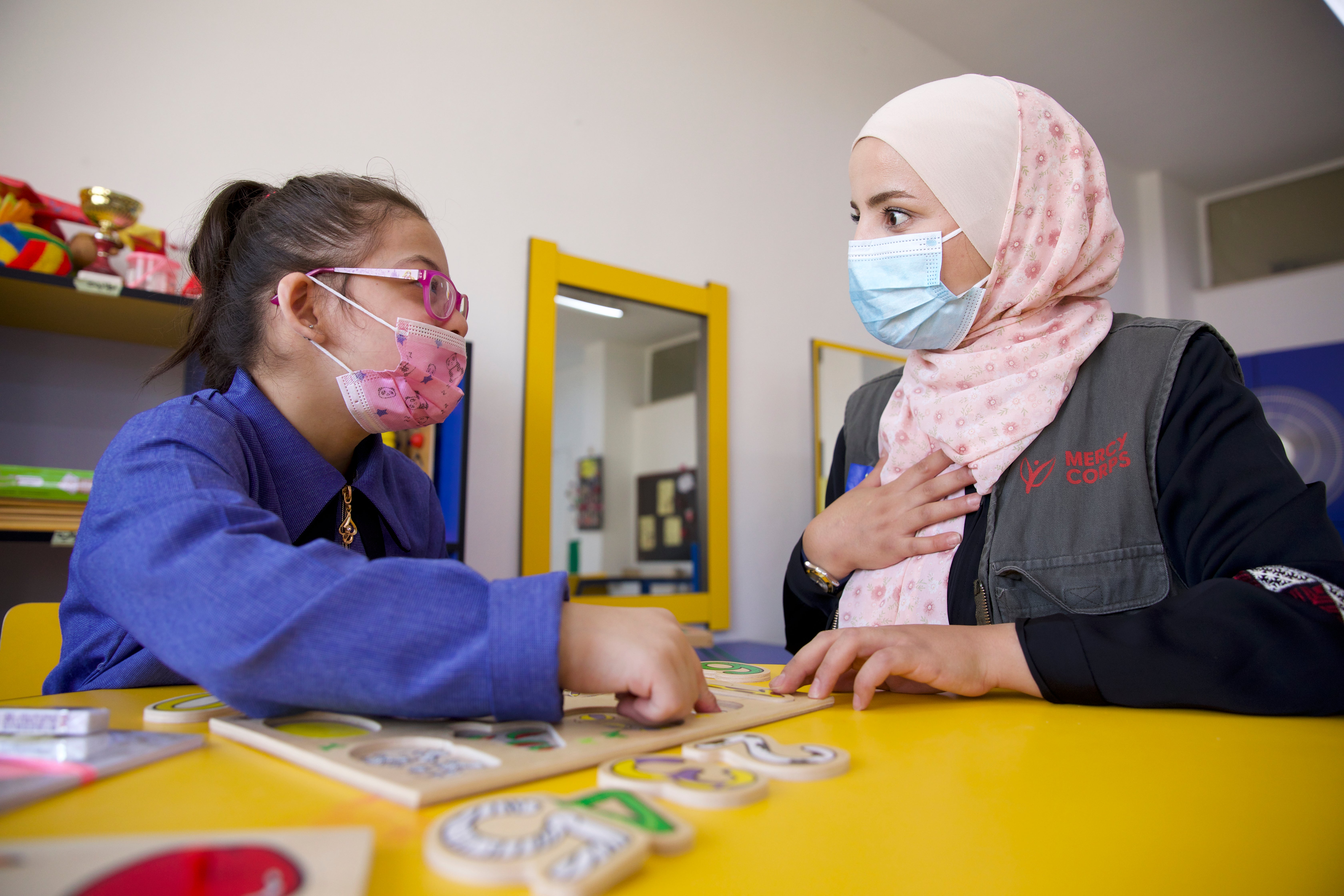 A student and an instructor working together.