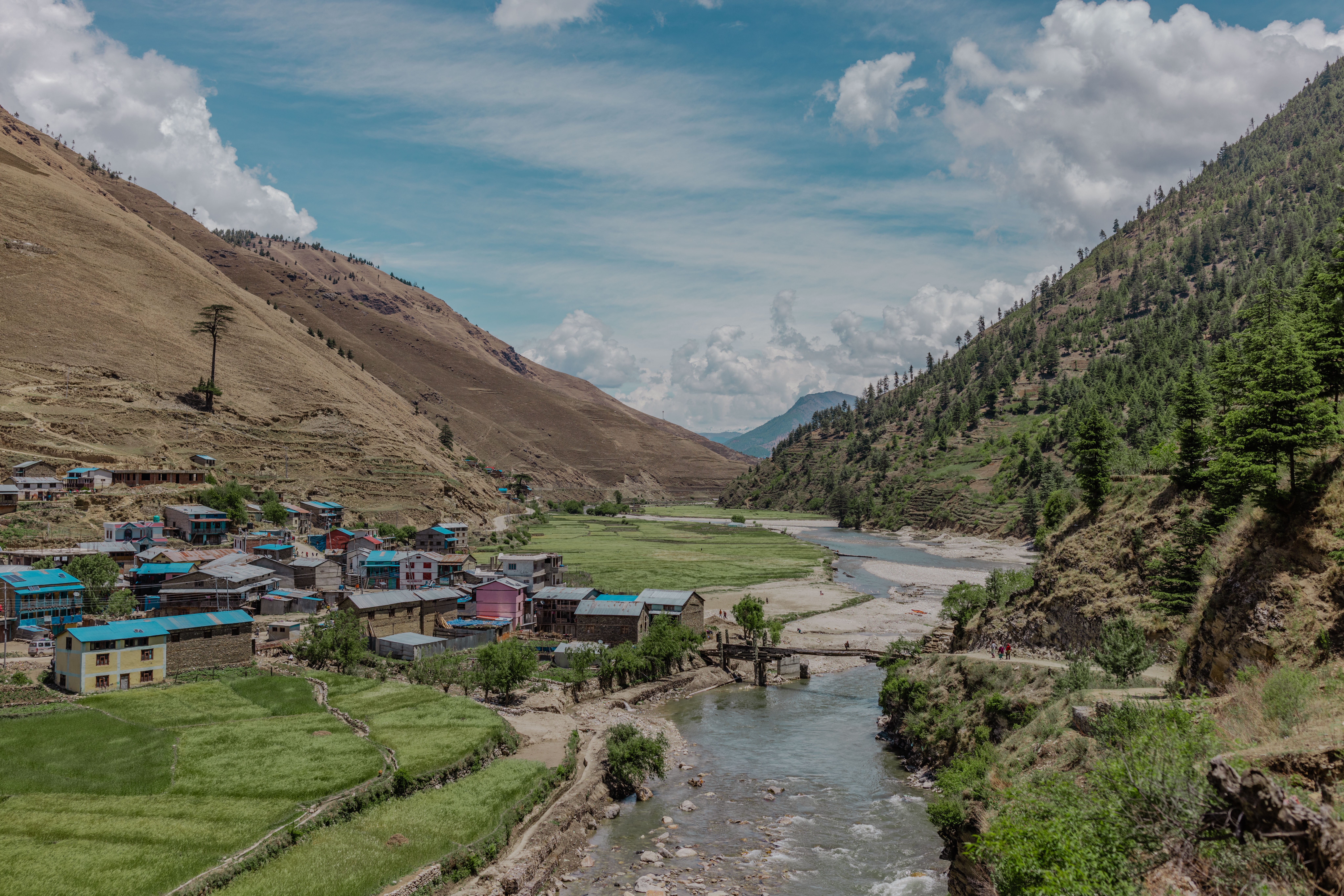Agricultural river scene in a valley in Nepal.