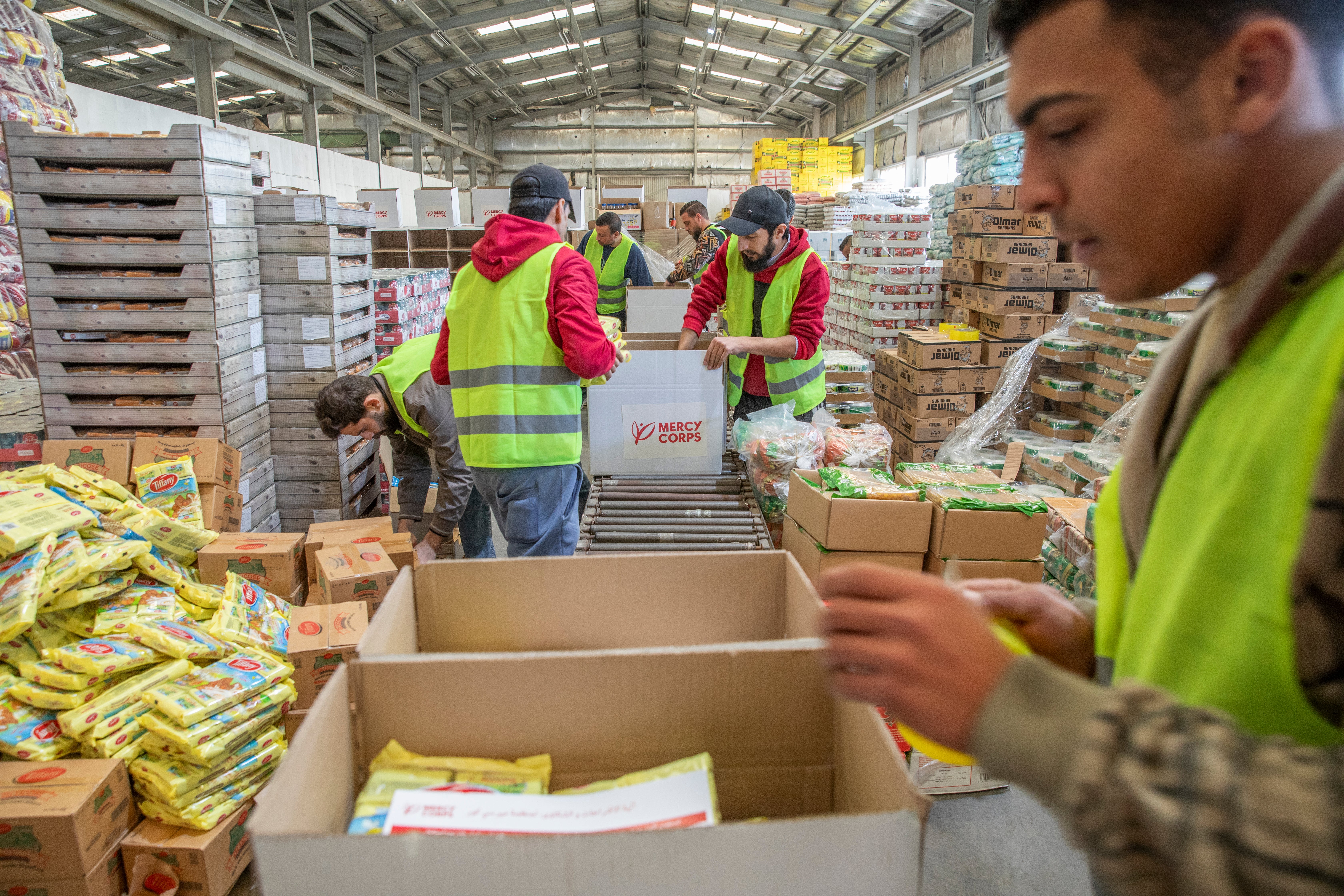 In Amman, Jordan, workers pack 1,300 Prosper Global food which will arrive in Egypt and trucked across the border into Gaza for distribution.
