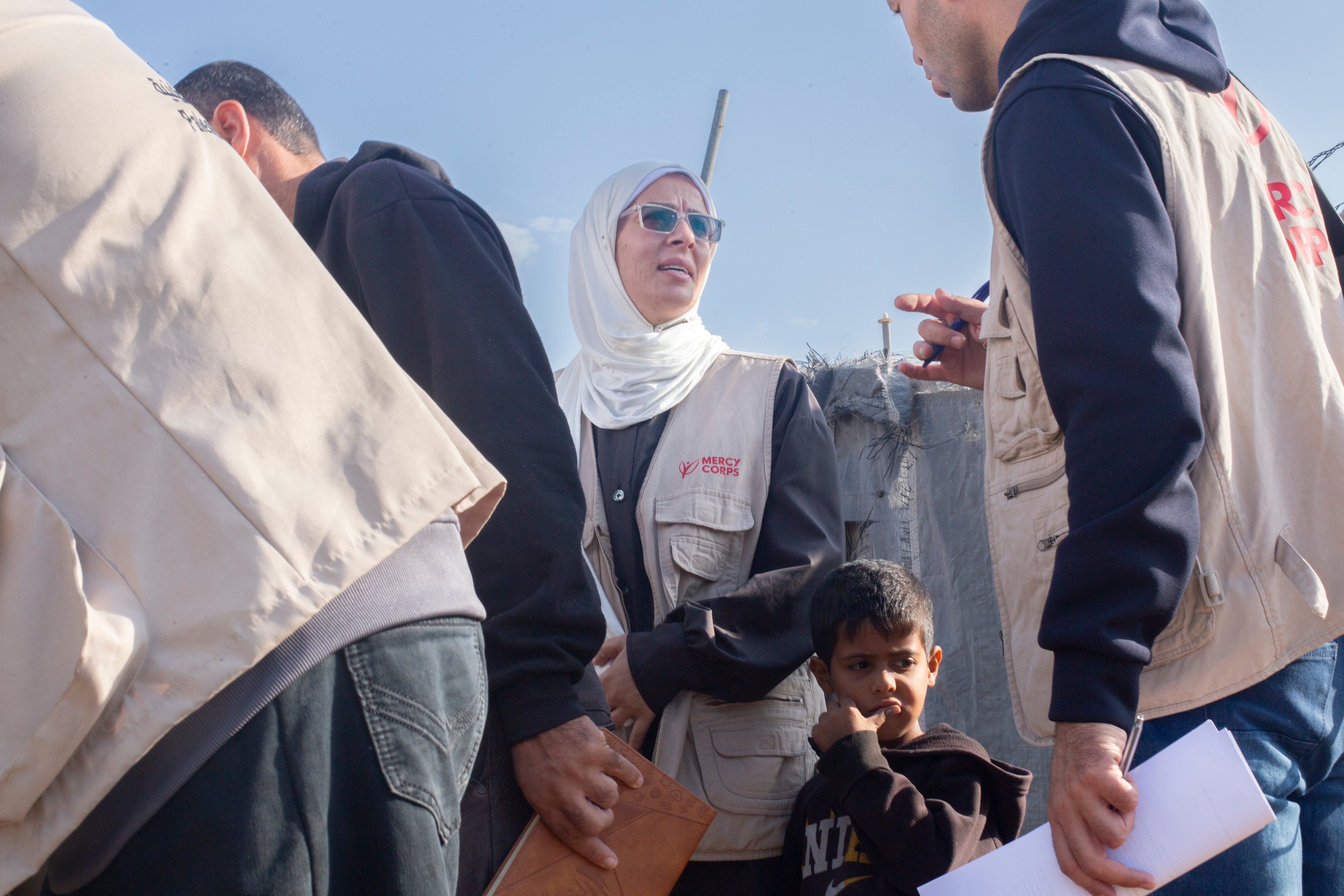 Image of Prosper Global aid worker among a group of other aid workers.