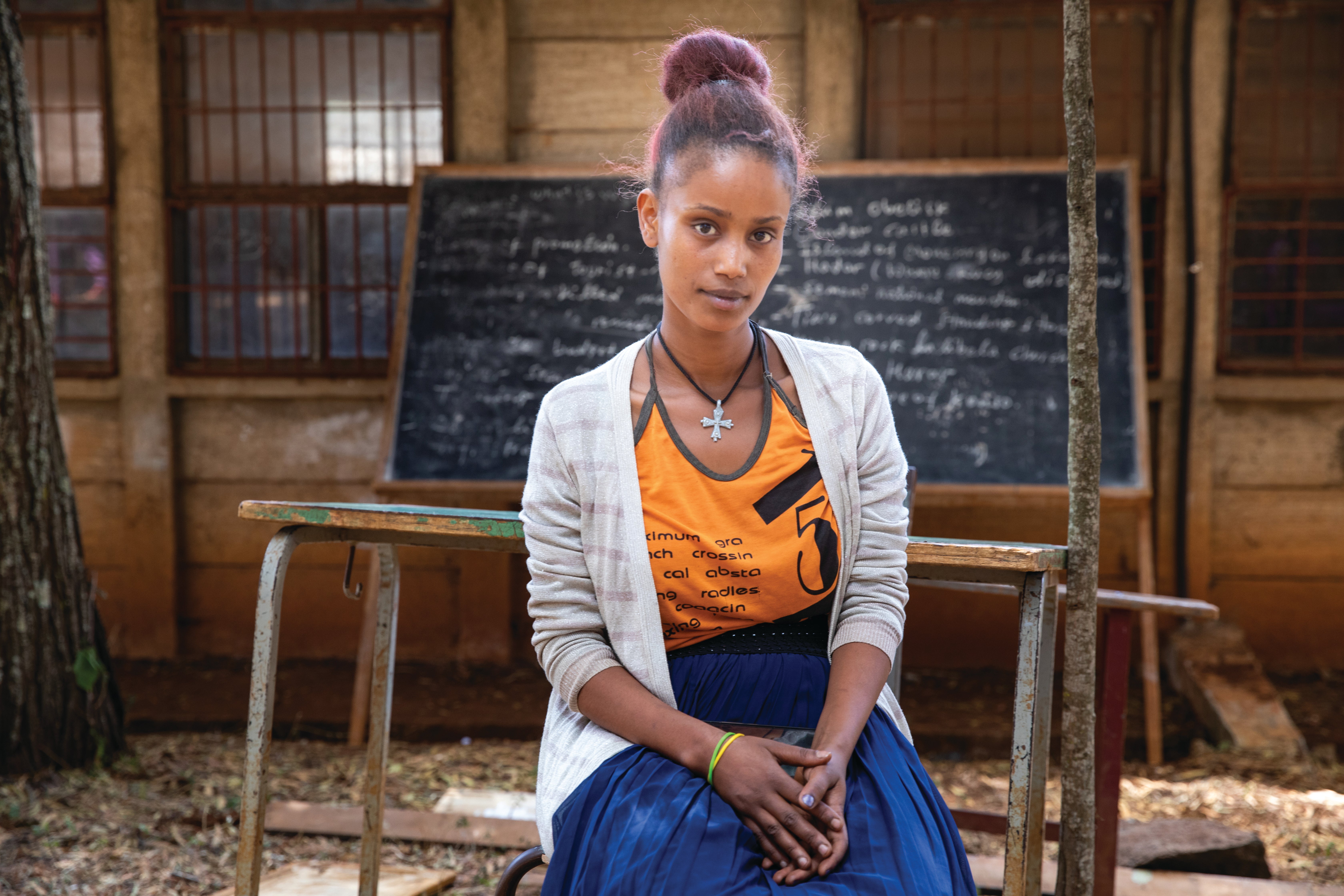Young woman in classroom setting.