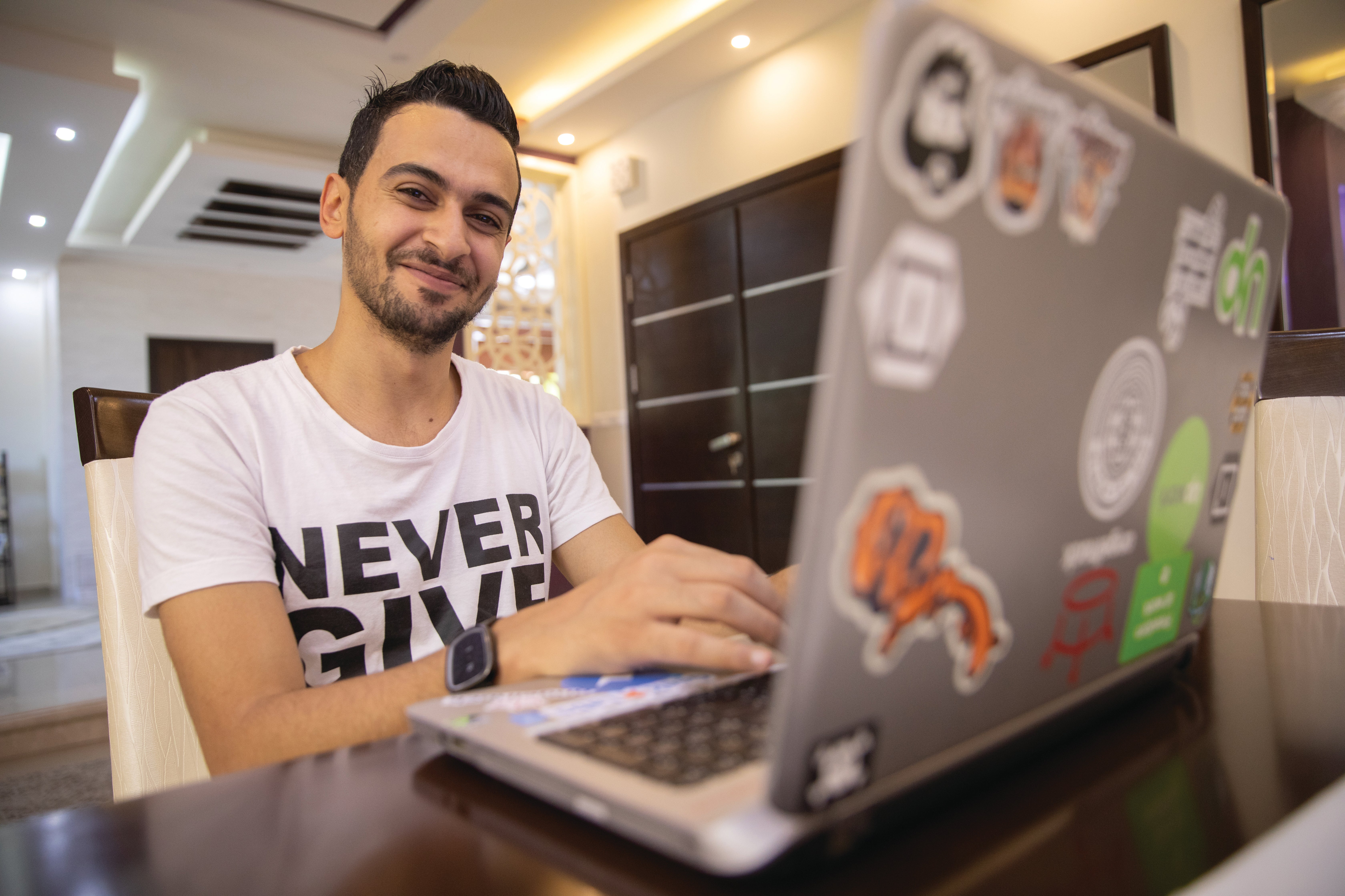 Young man in front of laptop.
