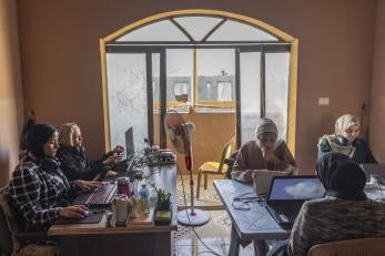 Tech workers at a co-working space supported by gaza sky geeks, helping young palestinians to access tech and online jobs.