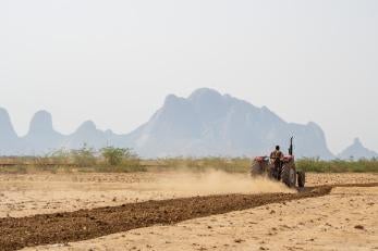 Hassan prepares a larger area for planting now that he has reliable access to water for irrigation.