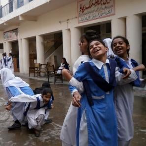 Girls laughing in a group arm lock