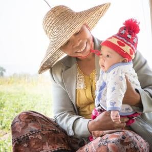 Zar ni lwin, a farmer in myanmar, with her 4-month-old grandson