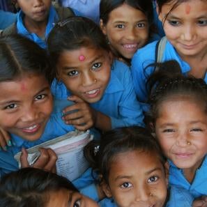 Girls smiling in blue uniforms