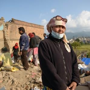Ram pictured in front of a damaged brick wall.