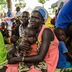 People and children sitting together in south sudan