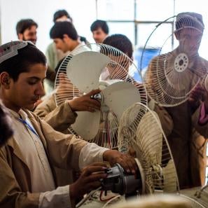 Men working in afghanistan repairing fans