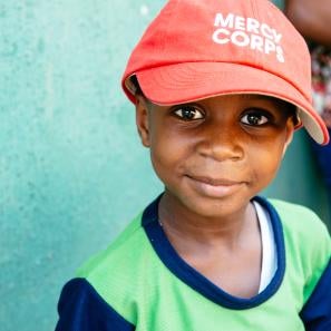 Child in prosper global hat