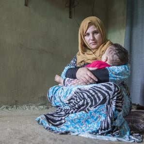 Maram holding her baby