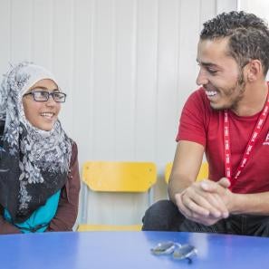 Amani speaking with a prosper global employee