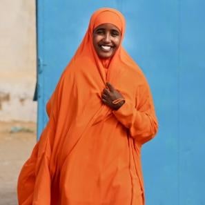 Woman wearing bright orange in somalia