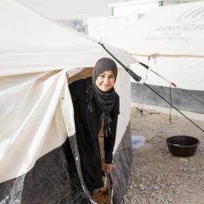 Nour leaves her tent in the refugee camp