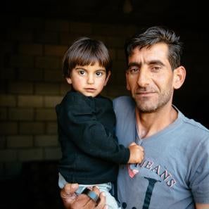 A man holding a young child