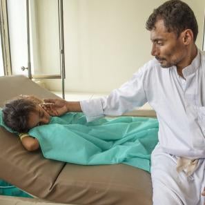 Abdullah sits with his 7-year-old daughter nehan as she receives treatment for cholera at a prosper global-supported health clinic in yemen. more than 1 million cholera cases have been reported since april 2017. photo: ezra millstein/prosper global