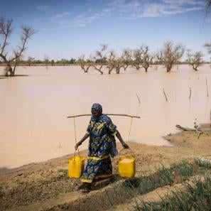 A person collecting water.
