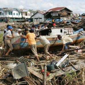 In meulaboh, indonesia, local fisherman clear boats and debris inland in the weeks after the devastating earthquake and tsunami in 2004.